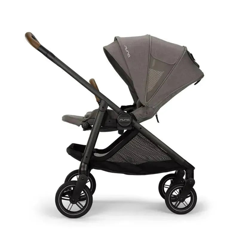 Nuna SWIV™ Stroller in Granite with a dark frame, adjustable canopy, and large storage basket.