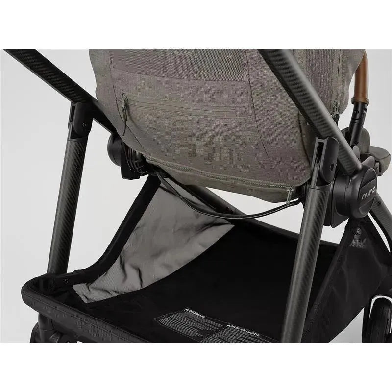 Nuna SWIV™ Stroller in Granite, featuring a stylish grey fabric seat and a spacious black storage basket underneath.