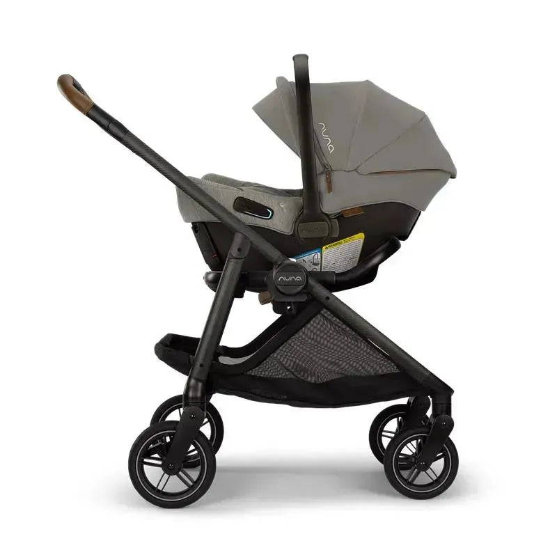 Nuna SWIV™ stroller in granite color, featuring a car seat attachment, adjustable sunshade, and five-spoke wheels.