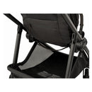 Nuna Swiv stroller with a black fabric seat, carbon frame, and spacious under-seat storage basket.