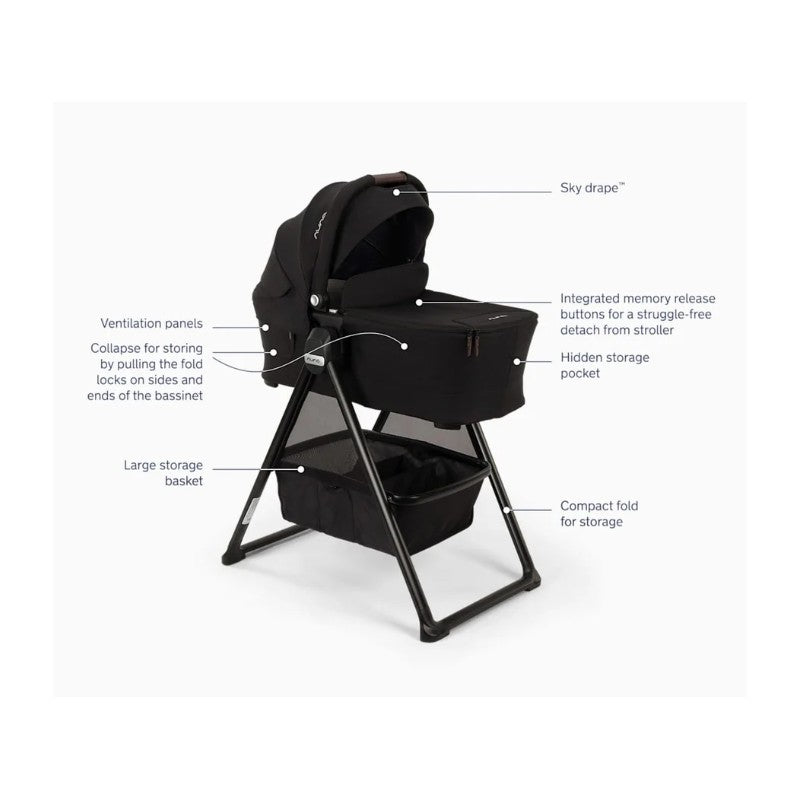 Nuna Swiv stroller with detachable bassinet and stand, featuring ventilation panels, large storage basket, and compact fold mechanism.