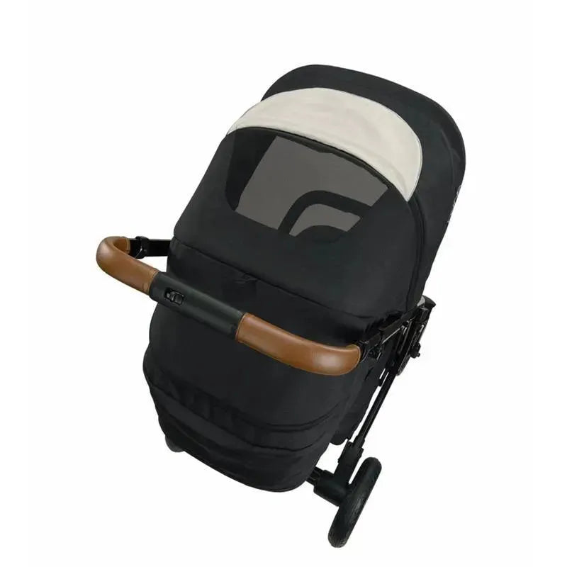 Nuna TAVO™ next Stroller in Caviar color, featuring a brown handlebar and a canopy with a window.