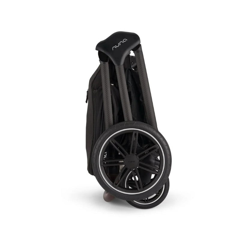 Nuna Triv Lx stroller in a folded position, featuring carbon fiber handles and sleek black wheels.