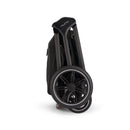 Nuna Triv Lx stroller in a folded position, featuring carbon fiber handles and sleek black wheels.