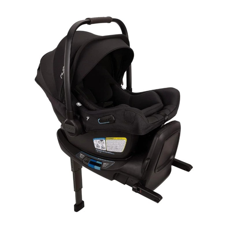 Nuna Triv Lx + Pipa Aire Rx travel system in Caviar color featuring a sleek car seat with safety labels and an adjustable handle.