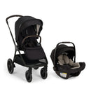 Nuna Triv Lx stroller in black with adjustable canopy next to Nuna Pipa Aire infant car seat in black and gray.