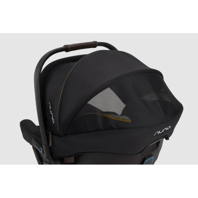 Nuna Triv Lx + Pipa Urbn Travel System in Caviar color, featuring a black canopy with mesh panel and brown handle.