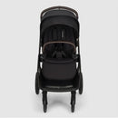 Nuna Triv Lx stroller in Caviar color, featuring a reclining seat, safety harness, and a modern design.