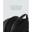 Nuna Triv Lx stroller with black and carbon fiber features and a brown handle, highlighting its lightweight and durable design.