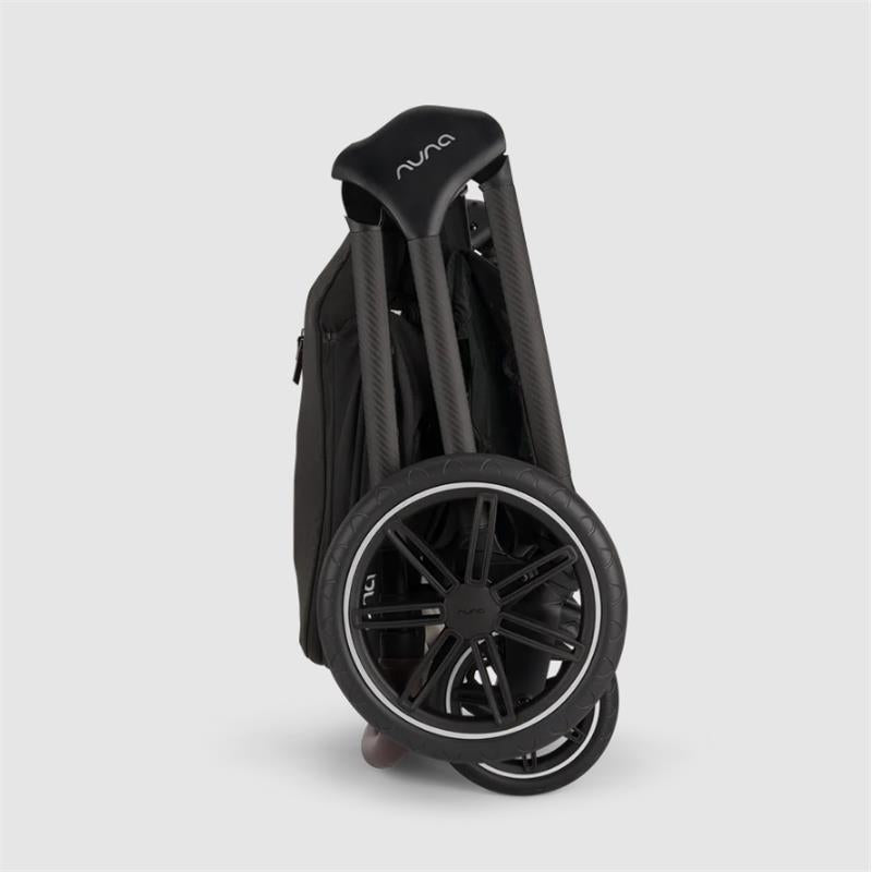 Nuna Triv Lx stroller in Caviar color, folded with a prominent wheel and handle design.
