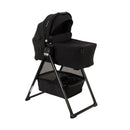 Nuna Triv Lx stroller with Triv bassinet and stand in caviar color, featuring a sleek design and storage basket below.