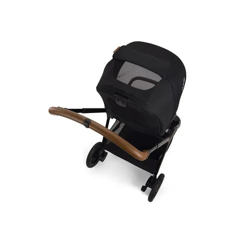 Nuna TRIV™ next stroller in Caviar/Cognac with a magnetic buckle, featuring a black fabric seat and brown handlebar.