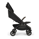 Nuna Trvl 360 Compact Stroller in Caviar color, featuring a sleek design, adjustable backrest, and large wheels for mobility.