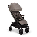 Nuna Trvl 360 Compact Stroller in Cedar color, featuring a reclining seat, adjustable canopy, and sturdy wheels.