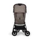 Nuna Trvl 360 Compact Stroller in Cedar color, featuring a sleek design, adjustable seat, and a lower storage basket.
