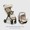 Nuna x BMW TRVL™ lx stroller in Mica with a travel bag, displayed alongside a PIPA™ aire rx infant car seat in Biscotti.