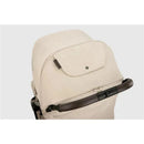 Nuna x BMW TRVL™ lx stroller in mica color, featuring a padded seat, a large hood, and a brown handle.