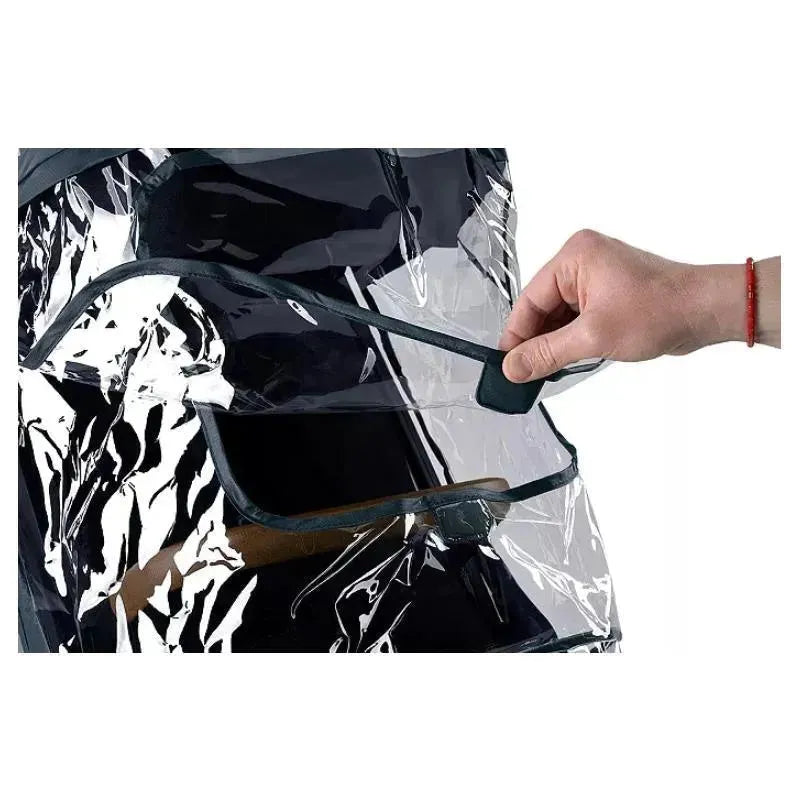 Transparent Nuna TRVL™ Series Rain Cover being handled, showcasing its protective design for strollers.