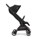 Ultra-compact Nuna VIAA™ cabn stroller in caviar color, featuring a reclining seat and adjustable canopy.