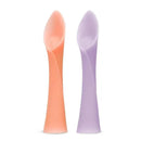 Soft-tip training spoons in coral and lilac colors, made of 100% silicone, designed for baby-led weaning.