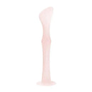 Diaper rash cream applicator with a suction base in coral color, designed for easy application.