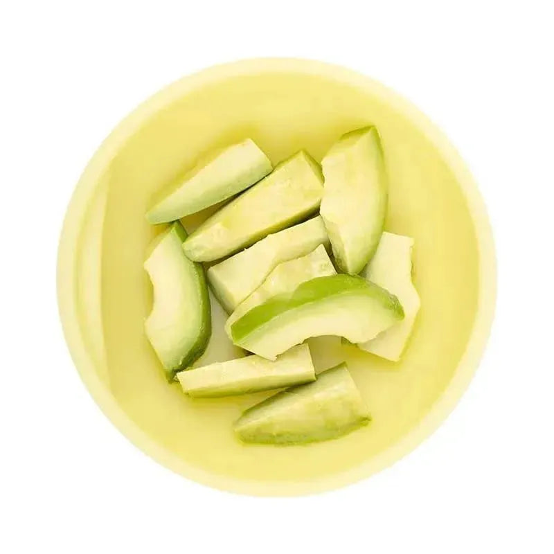 Suction bowl in lemon color containing slices of green apples.