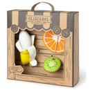Newborn gift set from Oli & Carol featuring natural rubber teething toys: a banana, orange, and kiwi, packaged attractively.