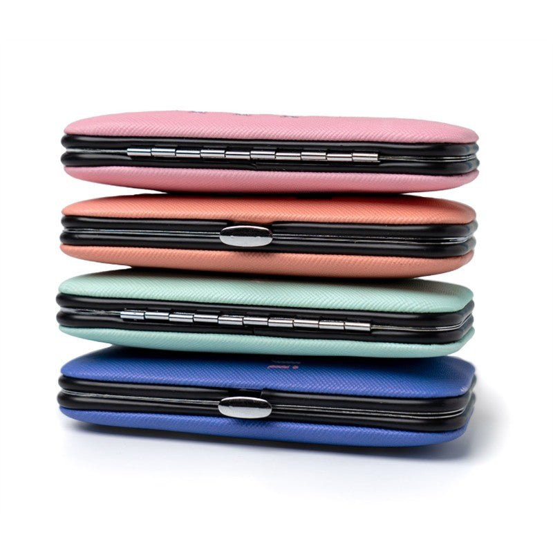 Manicure kit featuring stacked multi-colored cases, including pink, coral, mint, and blue, with a sleek design.