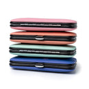 Manicure kit featuring stacked multi-colored cases, including pink, coral, mint, and blue, with a sleek design.