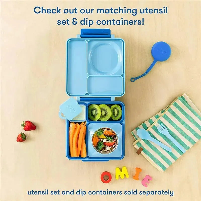 OmieBox in blue features a divided container with carrots, kiwi, and a salad, alongside utensils and a colorful napkin.