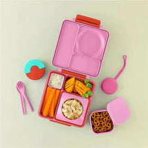 OmieBox in pink with various food items: carrots, mango, salad, and pretzels. Includes utensils and a lid.