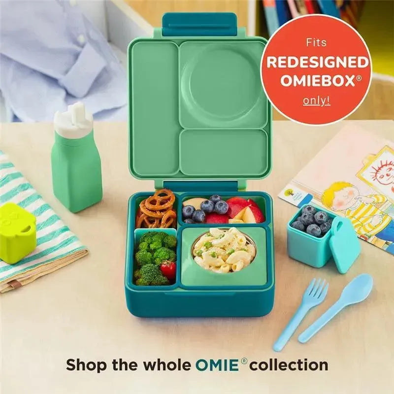 Leak-proof green silicone water bottle beside a colorful OmieBox lunch container with sections for food and a small utensil set.