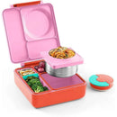 Insulated pink bento box open, featuring various compartments filled with pasta, broccoli, grapes, and a leak-proof thermos jar.