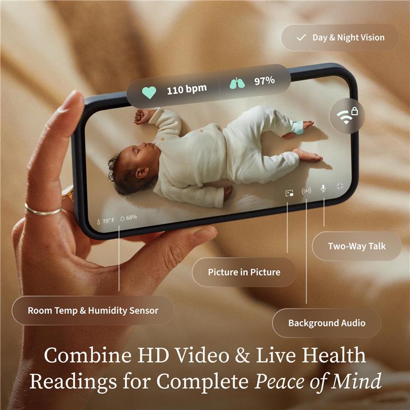Owlet Dream Duo™ 3 Baby Monitor in mint, displaying a sleeping baby with health readings on a smartphone.