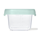 Clear food storage container with a mint green lid, marked with measurement indicators up to 4 ounces.