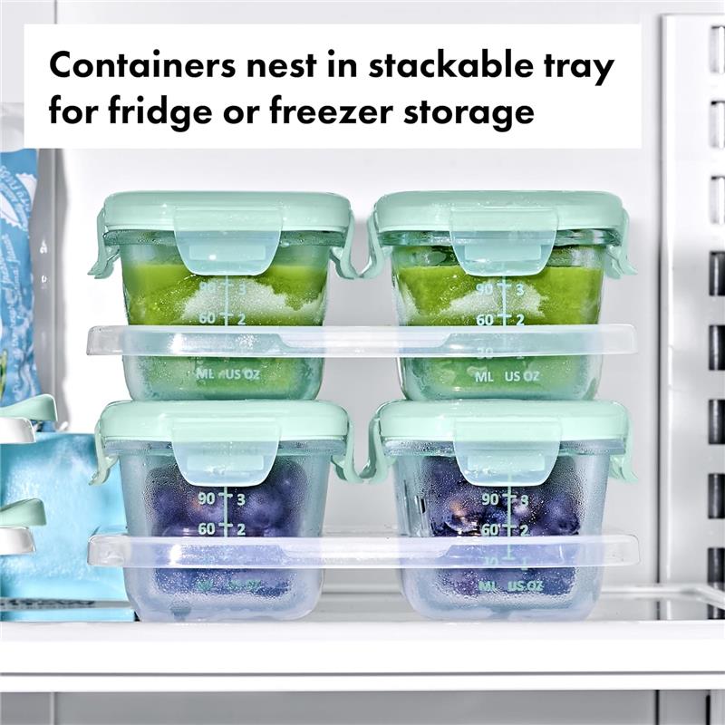 Oxo Tot Glass Baby Blocks in stackable trays, featuring green and purple food storage containers in a refrigerator.