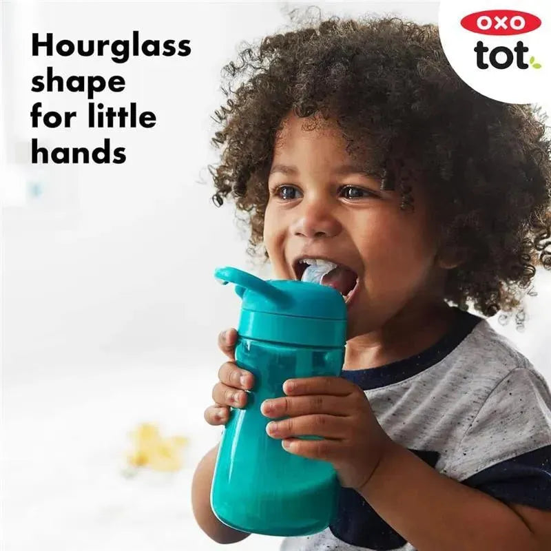 Oxo Tot Adventure Water Bottle in Dusk, held by a child, featuring an hourglass shape designed for small hands.