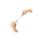 User is cleaning a baby bottle using the OXO Tot Bottle Brush with Bristle Cleaner, showcasing its effectiveness.