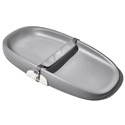 OXO Tot Changing Pad in gray with a soft surface and a safety strap for secure changing.