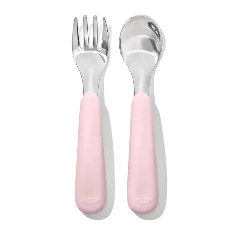 OXO Tot On-The-Go Fork and Spoon Set in Blossom, featuring stainless steel heads and soft pink handles.