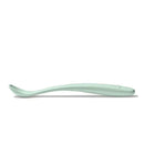 Soft green plastic feeding spoon designed for infants, featuring a curved handle and shallow bowl.