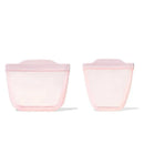 Pink silicone reusable bags from the Oxo Tot Cup and Snack Set, featuring soft shapes and two sizes for versatile use.