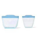 Oxo Tot silicone reusable bags in dusk color, featuring one larger and one smaller bag with blue tops.