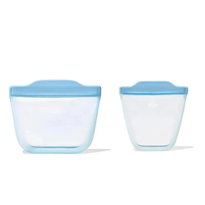 Oxo Tot silicone reusable bags in dusk color, featuring one larger and one smaller bag with blue tops.