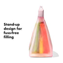 Silicone reusable bag with a stand-up design, showcasing colorful snack contents, labeled for easy filling.