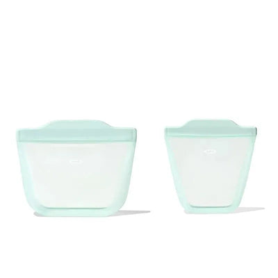 Oxo Tot Silicone Reusable Bags in opal color, featuring one larger and one smaller bag for snacks and cups.