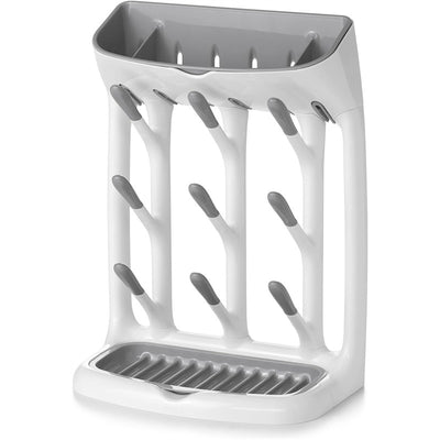 OXO Tot Space Saving Drying Rack in gray features a sleek design with multiple slots for bottles and accessories, and a draining tray.