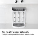 Compact gray drying rack with vertical slots for dishes, designed to fit under cabinets without clutter.