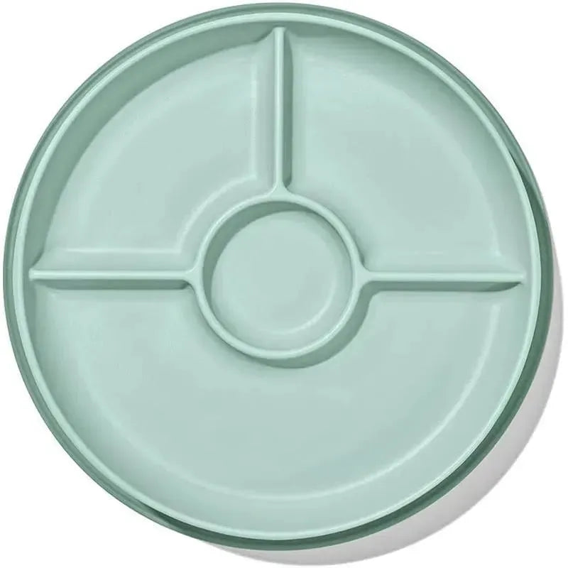 Suction divided plate in opal color with three compartments and a central dip area.