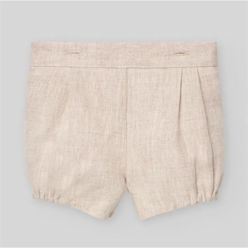 Woven cream shorts for baby boys, featuring pleats and elasticized cuffs, part of the Paz Rodriguez newborn set.